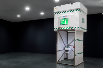 Hughes 2000L tank-fed emergency safety shower in a showroom