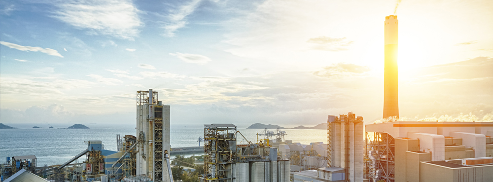 petrochemical plant with bright sunshine behind