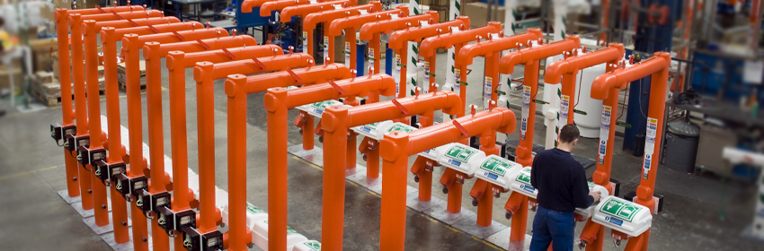 Row of Hughes safety showers in customised orange finish