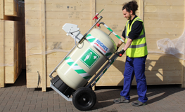 Worker in high vis transporting Hughes mobile safety shower