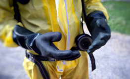 Hands of worker in PPE