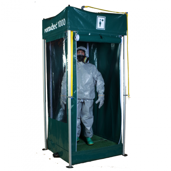 Hughes portable decontamination unit in use by worker in PPE
