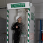 Multi-nozzle cubicle safety shower with detergent inducer and hose brush